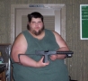  -  Fat Guy Shows Off Gun